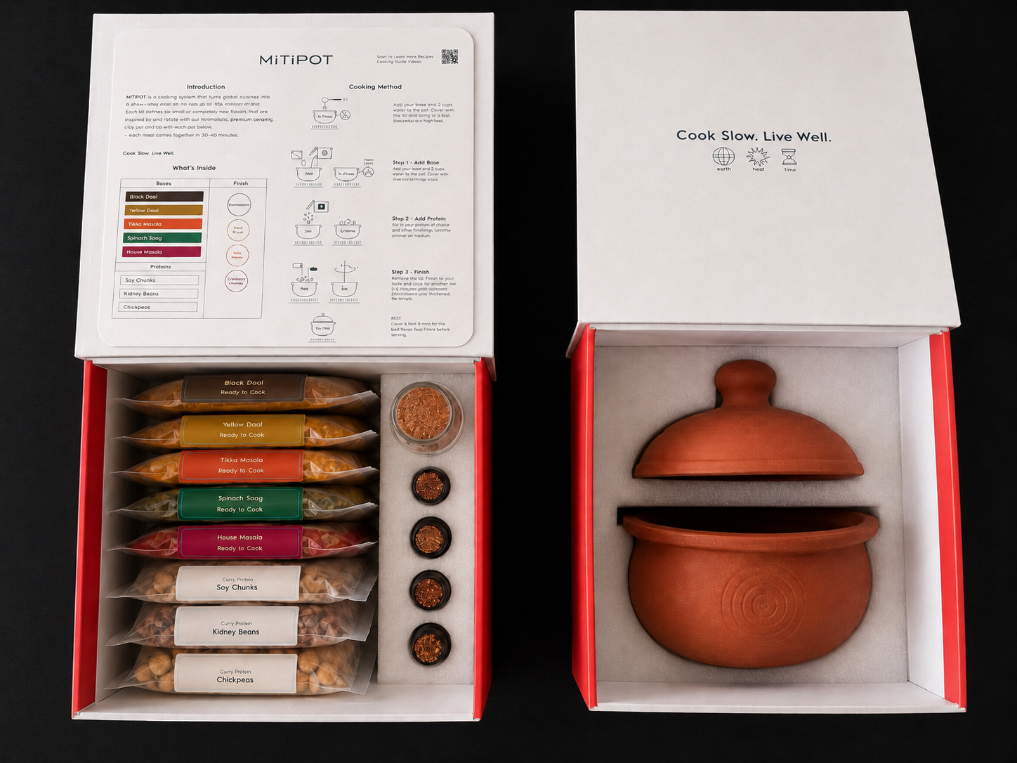 The First Fire boxes open — the ingredient box with five bases, three proteins, four tadka oils and Bloomasala, beside the pot box holding the handmade Mitipot